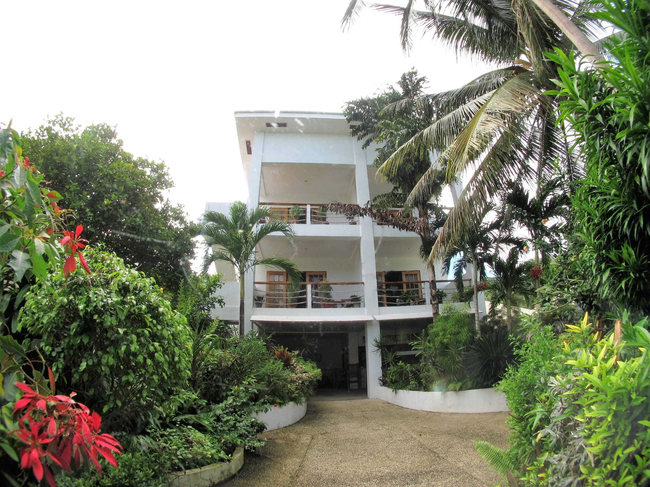 Apartment building set back from the beach